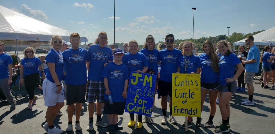 NHS Students pictured with their buddy Curtis